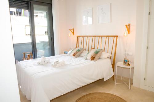 Postel nebo postele na pokoji v ubytování Casa del Carmen - Terraza y Paseo Marítimo