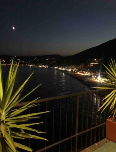 a view of a body of water at night at Casa Isola in Bergeggi