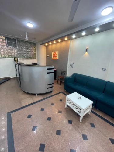 a living room with a couch and a table at Grand Hotel Qena in Qena