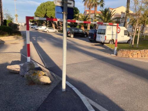 a street with several signs on the side of a road at Maison du pêcheur bord de mer - 2 à 4 pers in Saint-Raphaël