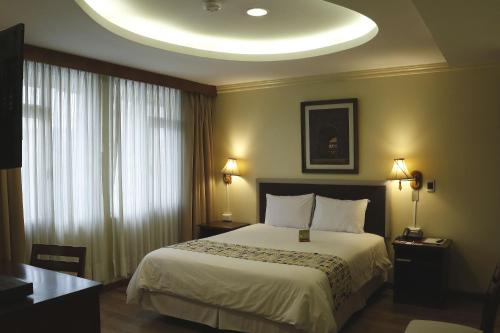 Ένα ή περισσότερα κρεβάτια σε δωμάτιο στο Hotel Republica