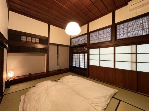 Gulta vai gultas numurā naktsmītnē Syokoutotaikennoyado Magokoro - Vacation STAY 46027v