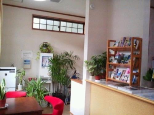 a room with potted plants on the wall at Sudomari no Yado Sunmore - Vacation STAY 46732v in Nikko