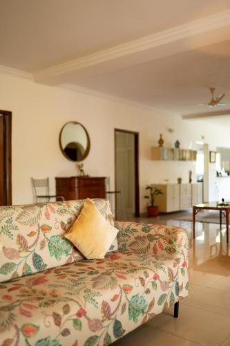 a living room with a couch and a table at Luho 206 in Bangalore