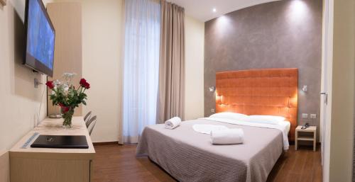 מיטה או מיטות בחדר ב-Hotel La Madonnina