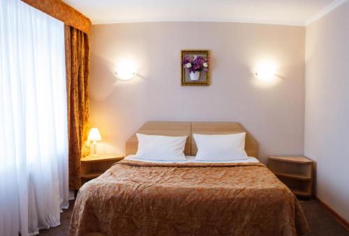 Cama o camas de una habitación en Bulgar Hotel