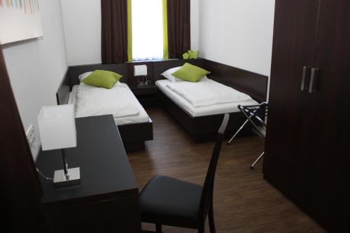 Postel nebo postele na pokoji v ubytování Hotel Schwan - Das Gästehaus Ilse
