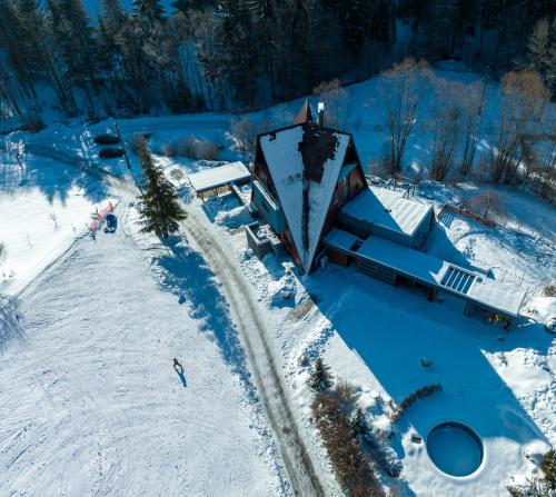an aerial view of a house in the snow at Vila Anna Wellness in Halenkov