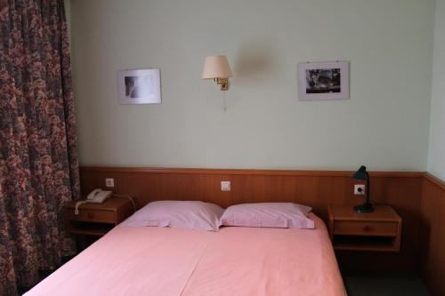 Postel nebo postele na pokoji v ubytování Hotel de Foetz
