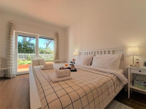 a bedroom with a large bed and a window at Romantic Apartment Anna in the center of Krk in Krk