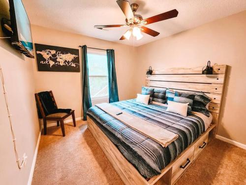 a bedroom with a bed and a ceiling fan at Percy Priest Lake2 Quiet Family Home in La Vergne