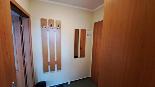a room with three wooden panels on the wall at Penzion Aida Ostrava in Ostrava