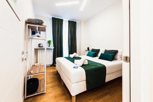 Voodi või voodid majutusasutuse Gegix's Rooms Milano toas