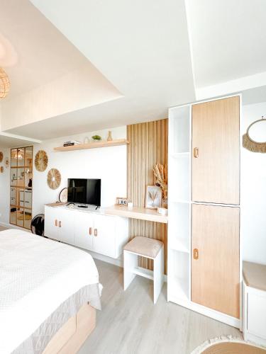 Ένα ή περισσότερα κρεβάτια σε δωμάτιο στο Serenity Sanctuary at Azure North Residences