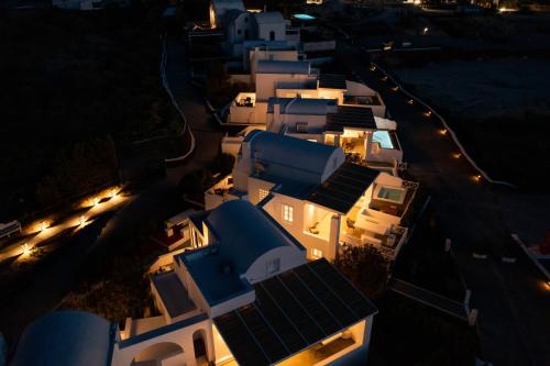 an overhead view of a row of white houses at night at Oia Sunset Villas in Oia