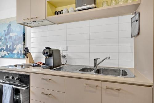 Η κουζίνα ή μικρή κουζίνα στο Grosvenor 3121 Richmond
