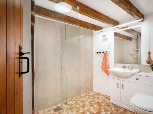 a bathroom with a shower and a sink at Ash Cottage in Launceston