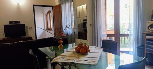 a table with a bowl of pumpkins on it in a living room at Casa Lilla 1 e 2 in Oristano