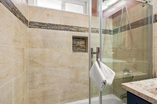 a bathroom with a shower with a glass door at Goleta Getaway in Santa Barbara