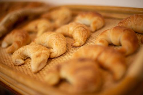a tray filled with croissants on a table at Hotel Suizo in Neuquén