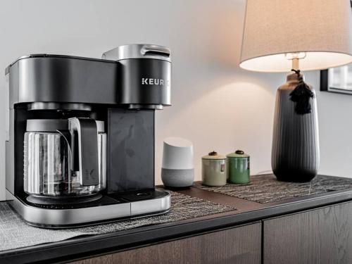 a coffee maker sitting on a counter with a lamp at Luxury Condo on Bay Street in Toronto