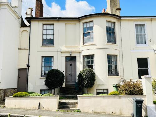 a white house with a front door at 3 Bedroom House, ST9, Ryde, Isle of Wight in Ryde