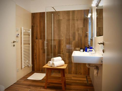 a bathroom with a sink and a shower at Bergblick in Werfenweng