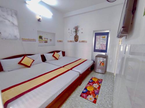 Postel nebo postele na pokoji v ubytování Minh Hiền Hotel
