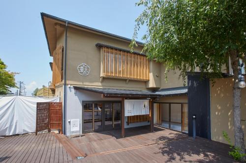 a house that is under construction with a deck at Ichiraku tendo spa & brewery in Tendo