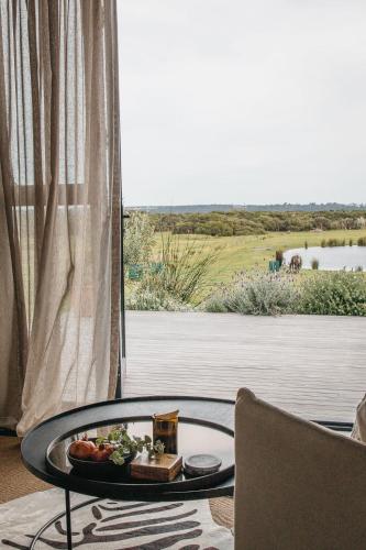 a tray of food on a table in a living room at Majuba Country Lodge in Kalgan