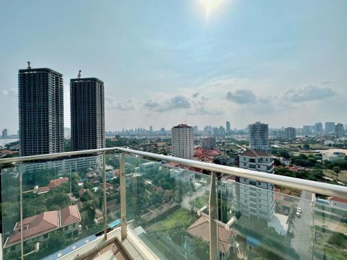a view of a city from the balcony of a building at Infinity 28 Hotel and Residence in Phnom Penh