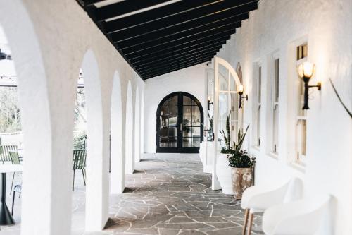 a hallway with white walls and a black ceiling at The Oaks Ranch in Tomakin