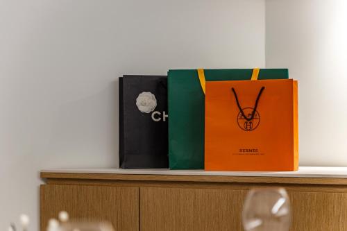 three books sitting on top of a shelf at Brown Dot Hotel Cheonan Buldang in Cheonan