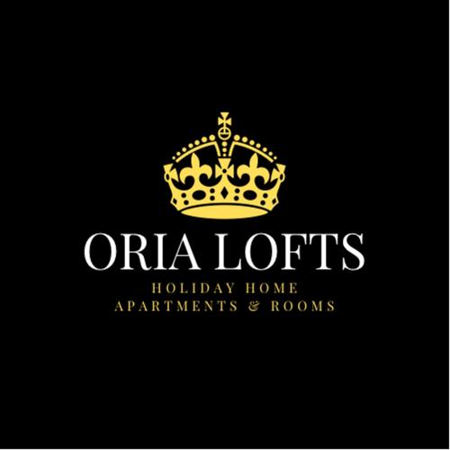 a gold crown on top of a hotel logo at Oria Lofts in Oria