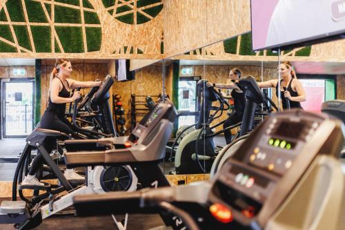 a group of people on treadmills in a gym at BIG4 Sandstone Point Holiday Resort Bribie Island in Bongaree
