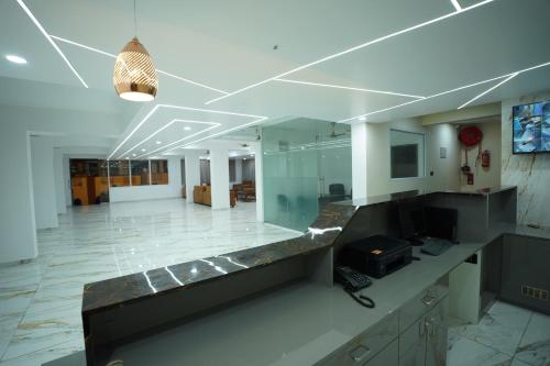 a large room with a lobby with a desk at Hotel Mangalore Stay INN in Mangalore