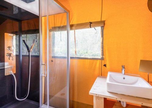 a bathroom with a sink and a shower at Dovestone Holiday Park in Greenfield