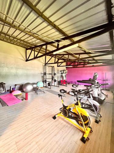 a gym with two bikes parked in a room at JC ITEN Guest House in Iten