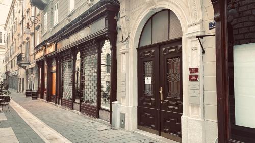 a row of doors on the side of a building at Residenza Le 6 A in Trieste