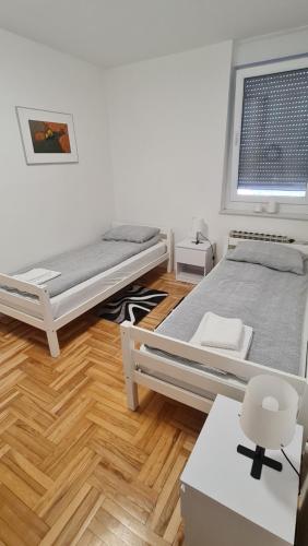 Posteľ alebo postele v izbe v ubytovaní South 2 Osijek
