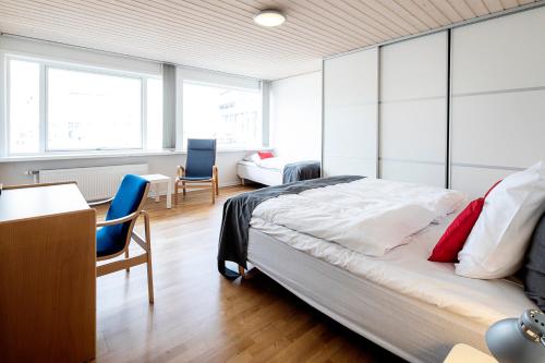 Postel nebo postele na pokoji v ubytování KOMPAS Hotel Aalborg