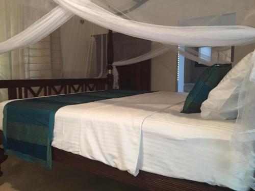 Ένα ή περισσότερα κρεβάτια σε δωμάτιο στο Lali Villa & Fruit Garden