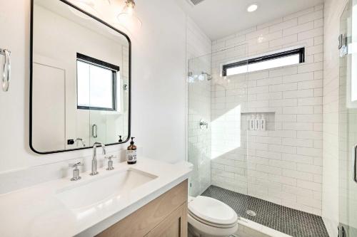 a white bathroom with a sink and a toilet at Mountain-View Townhome Near Powder Mountain! in Huntsville