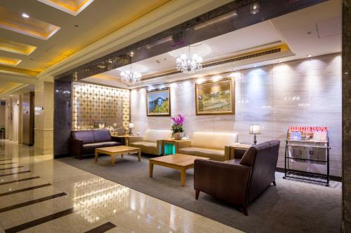 a lobby of a hotel with couches and chairs at Grand View Hotel in Yuanlin