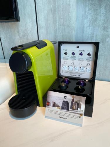 a yellow and black appliance sitting on top of a table at M Resort & Hotel Kuala Lumpur in Kuala Lumpur