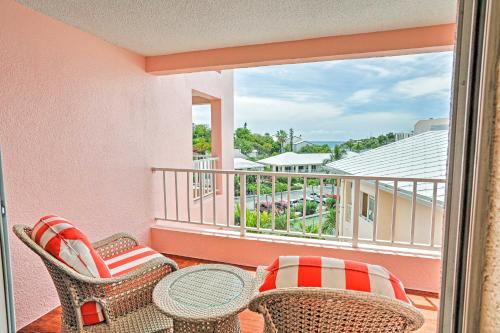 a balcony with wicker chairs and a table at Elysian Resort Condo with 3 Balconies and Amenities! in St Thomas