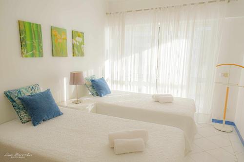 Postel nebo postele na pokoji v ubytování Apartamento Concorde Vista mar e praia