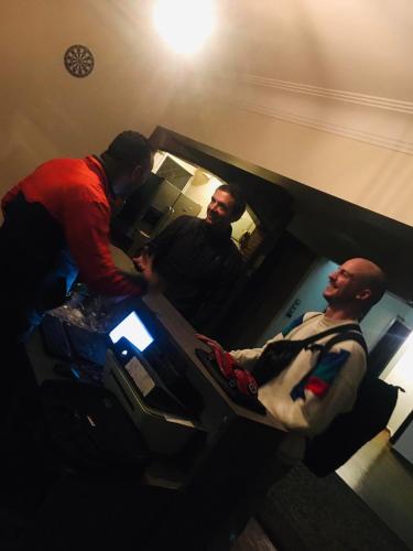 a group of men standing in a room with a patient at Zamalek X Hostel-Nile view in Cairo