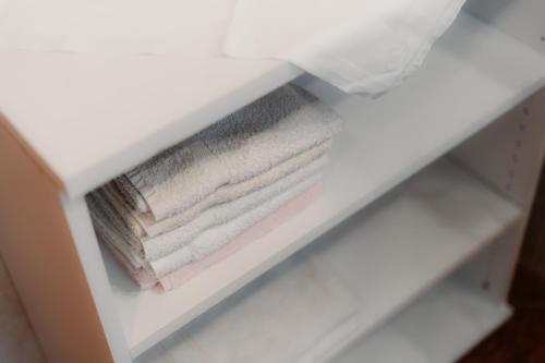 a stack of towels in a white drawer at Annis Ausblick - Deine Unterkunft im Salzkammergut in Bad Goisern