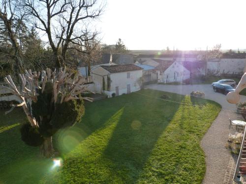 an aerial view of a yard with a house at Logis de L'Arceau in Celles